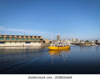 Yellow Fisherboat Leaving The Harbour