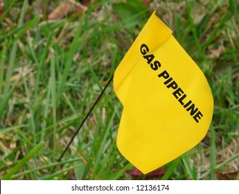 Yellow Flag Marking Underground Natural Gas Line In Yard.