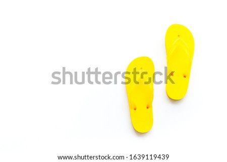 Yellow Flip-flops .White background top view,flat lay, mockup