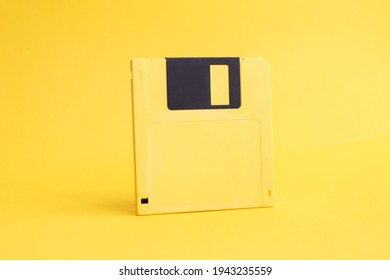 Yellow Floppy Disk 3.5 Inch On Yellow Background