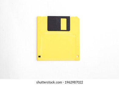 Yellow Floppy Disk On White Background.