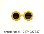 yellow flower-shaped sunglasses on a white background