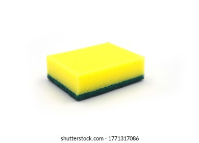 Yellow Foam Rubber Sponge For Dishwashing On White Background. House Cleaning Tool. Simple Everyday Cleaning Sponge Studio Photo. Everyday Routine Domestic Chores. House Duties Equipment. Foam Rubber