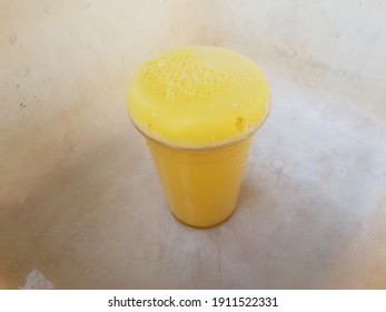 Yellow Foam Science Experiment Overflowing Cup In Plastic Container