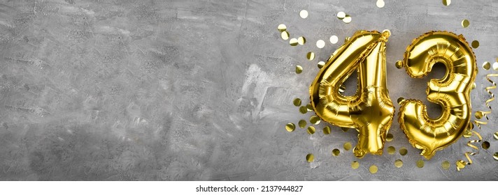 Yellow foil balloon number, number forty three concrete background. Greeting card with the inscription 43. Anniversary concept. for anniversary, birthday, new year celebration. banner, copy space. - Shutterstock ID 2137944827