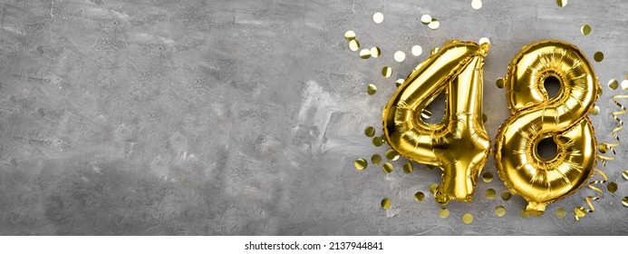 Yellow foil balloon number, number forty eight concrete background. Greeting card with the inscription 48. Anniversary concept. for anniversary, birthday, new year celebration. banner, copy space. - Shutterstock ID 2137944841