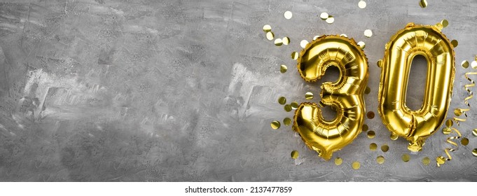 Yellow foil balloon number, number thirty on a concrete background. 30th birthday card. Anniversary concept. for anniversary, birthday, new year celebration. banner, copy space. - Shutterstock ID 2137477859
