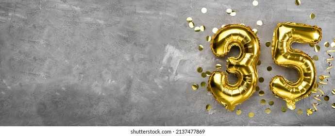 Yellow foil balloon number, number thirty-five on a concrete background. 35th birthday card. Anniversary concept. for anniversary, birthday, new year celebration. banner, copy space. - Shutterstock ID 2137477869