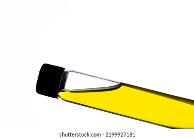 Yellow Food Coloring Added To Water In Glass Test Tube With Screw Cap