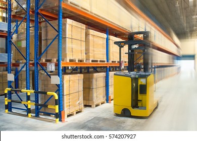 A yellow forklift at warehouse.
