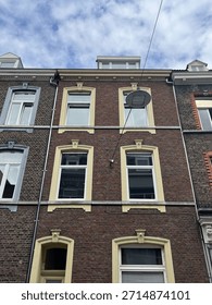 Yellow frames around windows on a building