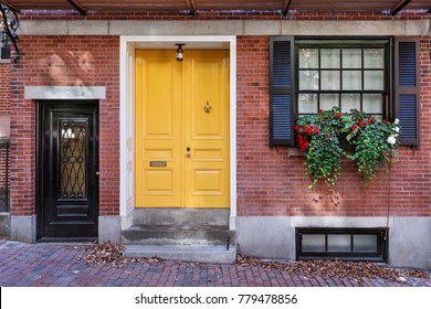 Yellow front door to classic style home 