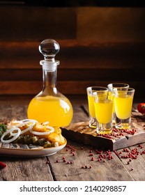 Yellow Fruit Liqueur With Russian Herring Appetizer