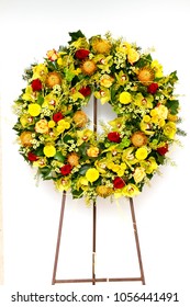 Yellow Funeral Wreath Isolated On A White Background.