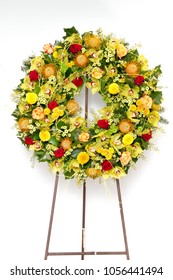 Yellow Funeral Wreath Isolated On A White Background.