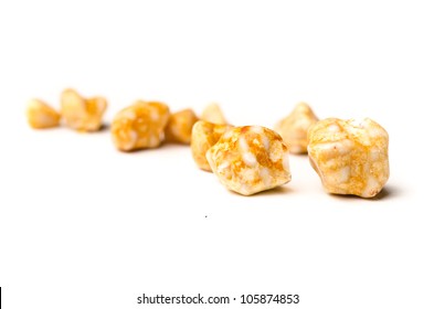 Yellow Gall Stones From A Persons Gall Bladder Over White Background