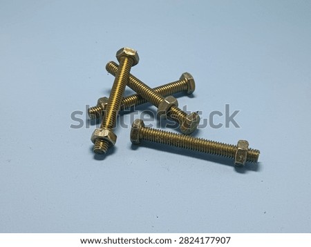 Yellow galvanized hexagonal bolts and nuts, commonly used in construction and household applications. These bolts feature a yellow galvanized coating to enhance rust resistance.