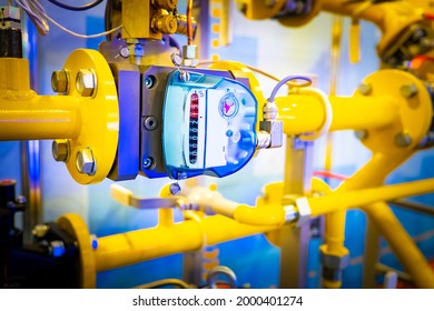 Yellow Gas Equipment. Gas Yellow Pipes With A Meter. Sensor Shows Amount Of Consumed Methane. Fragment Of Boiler Equipment Close-up. Fragment Of Gas Pipe In Boiler Room. Equipment For Boiler Room