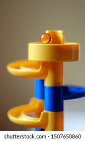 Yellow Glass Marble On A Marble Run Concept Game