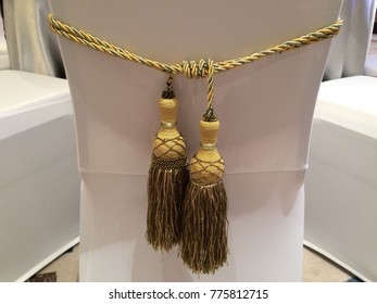 Yellow Gold Rope Curtain Tiebacks Are Used To Decorate At The Dining Chair For Sit Down Dinner In The Ballroom, Which Can Represent Tie The Knot Wedding.