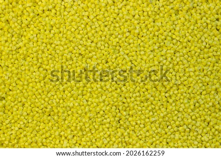 yellow granules of polypropylene or polyamide. background. Plastics and polymers industry. Copy space.