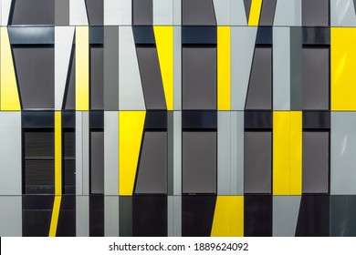 Yellow and Gray Decorative Facade Cladding Panels of Irregular Shapes. Geometric Facade. Modern Building. Abstract Architecture Photography.