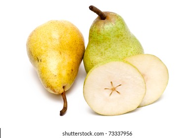 Yellow and green pear and some slices over white background - Shutterstock ID 73337956