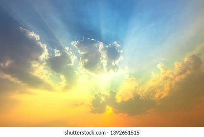 Yellow green sunset light in blue sky with clouds - Shutterstock ID 1392651515