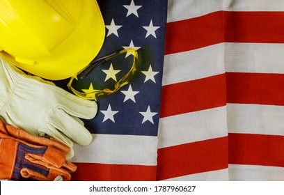 Yellow hard hat construction helmet leather gloves of United States America flag happy labor day - Powered by Shutterstock