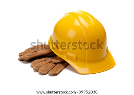 A yellow hard hat and leather work gloves on a white background