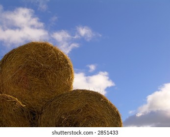Yellow haystack on the blue sky background