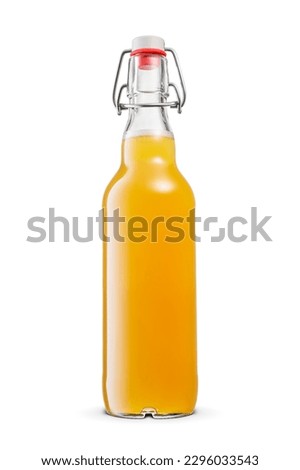 Yellow hazy wheat unfiltered beer in with vintage swing top transparent bottle without label isolated on white background.