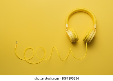 Yellow headphones on yellow background. Music concept. - Shutterstock ID 1097195234
