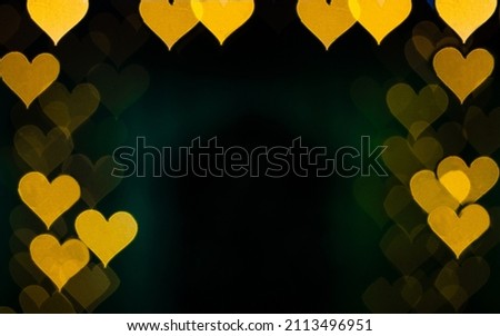 Yellow Heart bokeh on black background, Love concept. Theme for Valentines day. Free space. Copy space. High quality photo