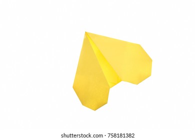 Yellow heart isolated on white. Simple origami art project for Valentine's day. Fun activity, easy crafts for kids.