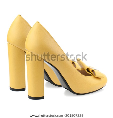 Yellow high heel women shoe isolated on white background.