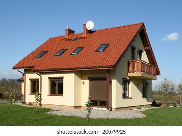Yellow home with red tiled roof. Nice architecture.