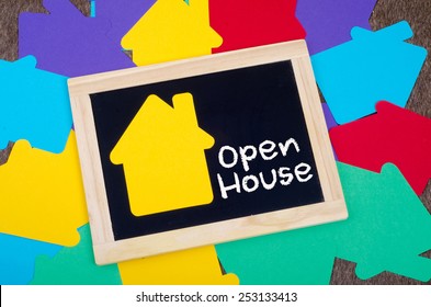 Yellow home sign on the blackboard: Open house