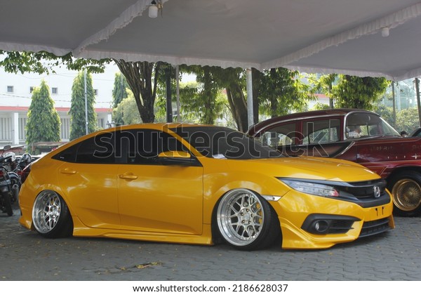 yellow honda civic turbo car, photo focus on yellow\
car, taken in surakarta, central java, indonesia on sunday 3 july\
2022