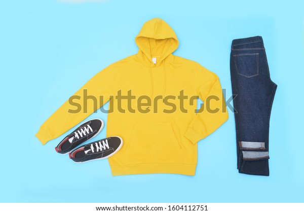 yellow hoodie black jeans