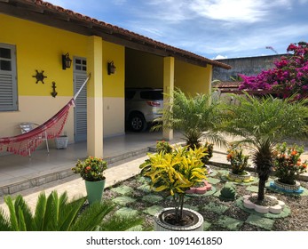 Yellow House Front Yard And Garage