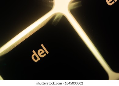 Yellow Illuminated Keyboard Delete Key Closeup