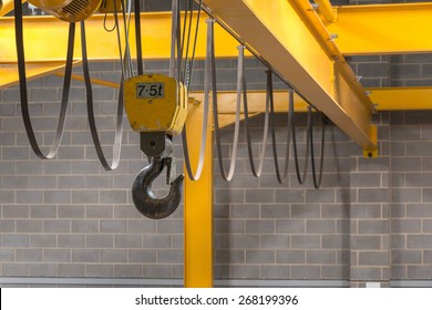 Yellow Indoor Crane's Hook and Black Sling  - Powered by Shutterstock