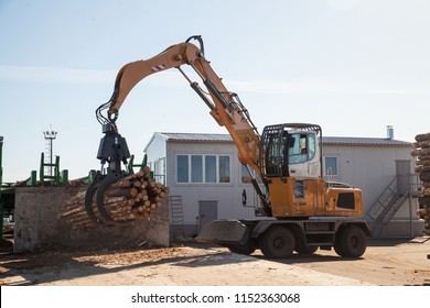 Yellow Industrial Log Loader On Sawmill 