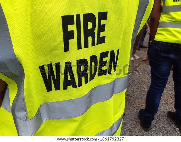 Yellow jacket showing fire warden on duty.\
Safety background.