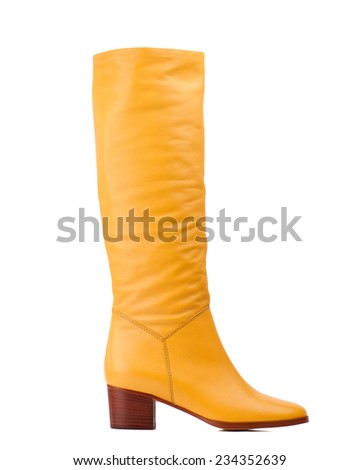 Yellow knee high boot isolated on white background. 