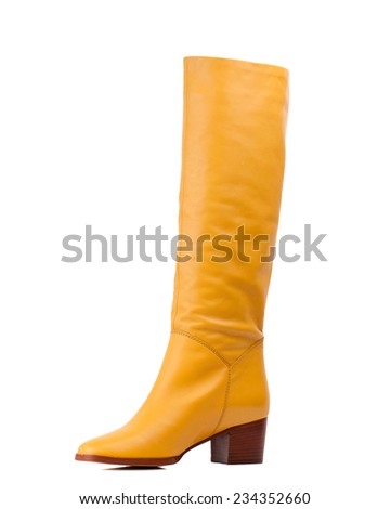 Yellow knee high boot isolated on white background. 