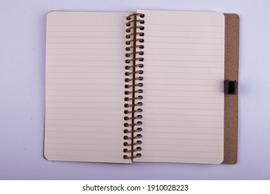 yellow leaf lined small notebook that can be carried in a pocket that is often used in daily life