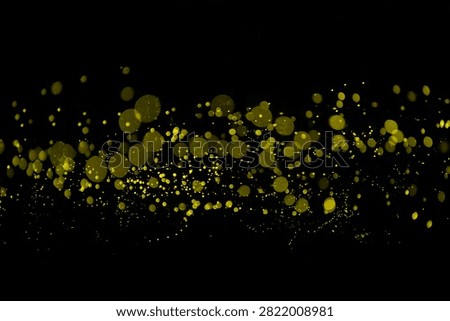 Yellow light bokeh of Firefly lightning bug on black background for graphic design