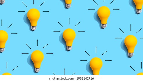 Yellow light bulb pattern with shadow - flat lay